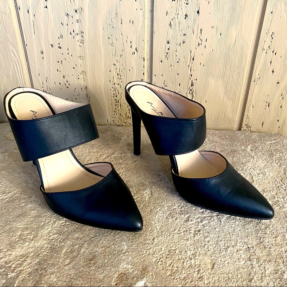 Beautiful Anne Michele Black leather high heeled shoes.